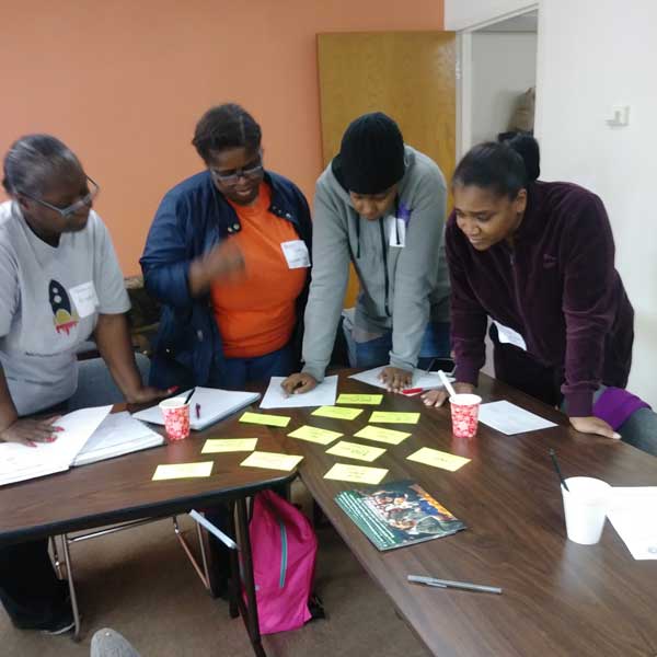 AdobeStock_605997179_Preview people working together around table