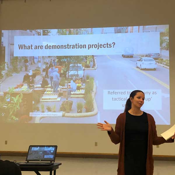 AdobeStock_605997179_Preview woman presenting