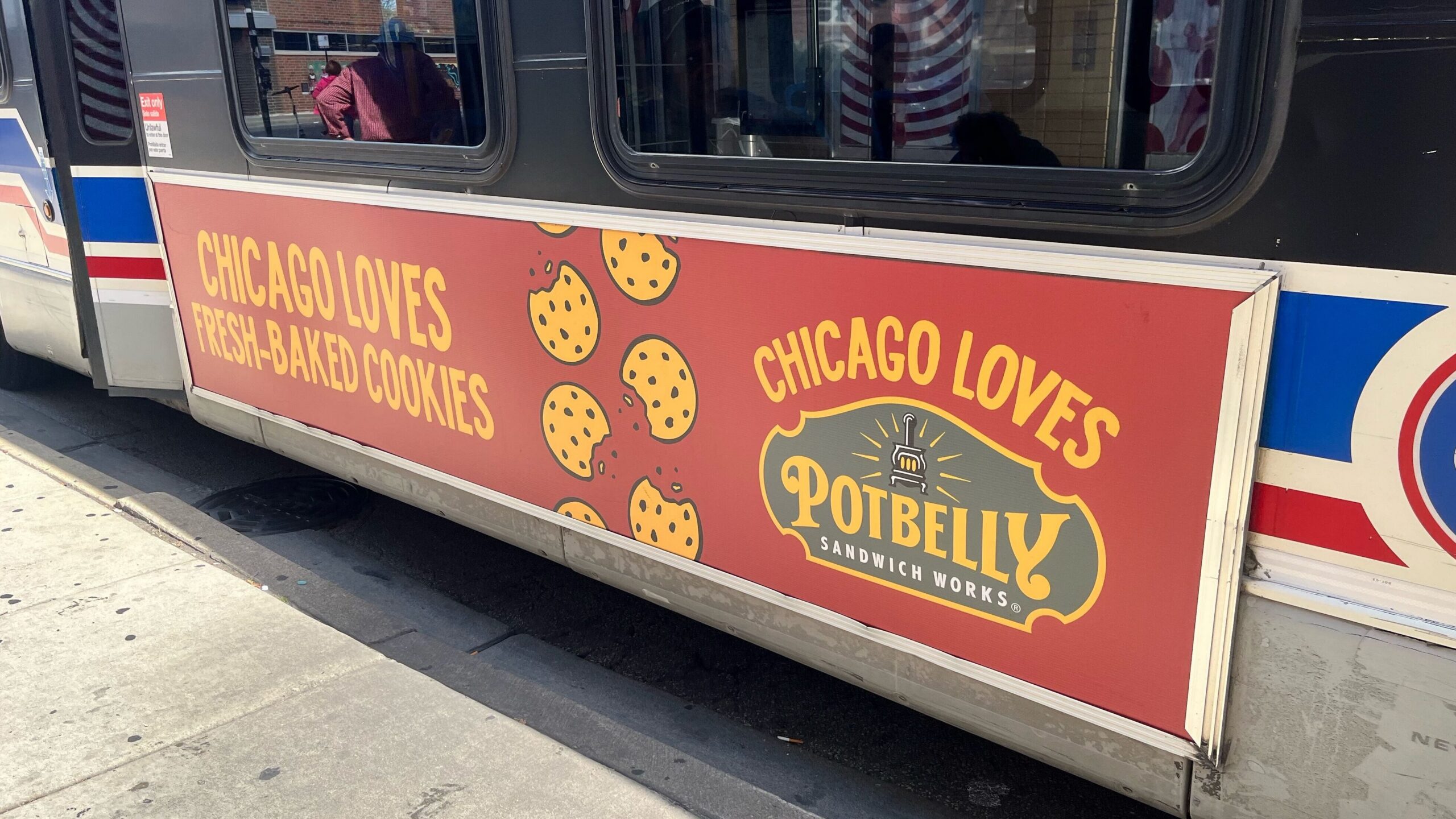Chicago Transit Authority bus with advertisement "Chicago loves fresh-baked cookies," sponsored by Potbelly Sandwich Works. 
