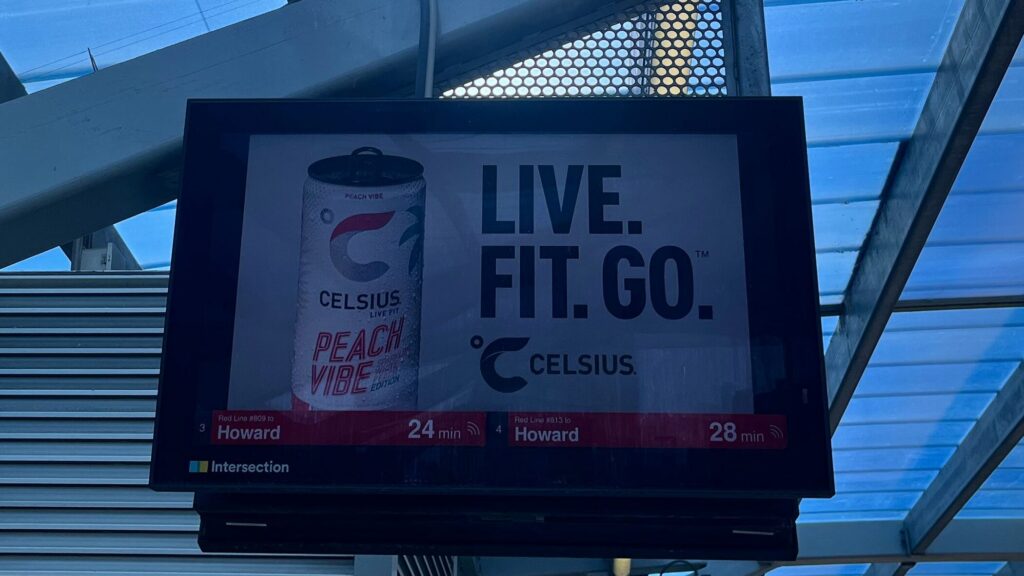 Chicago Transit Authority red line train sign depicting a Celsius drink advertisement.